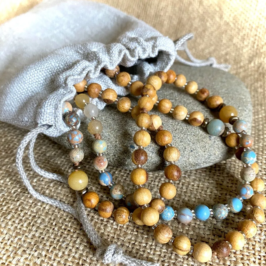 Palo Santo Mala with Nigerian Brass Guru Bead & Red Sari Silk Tassel