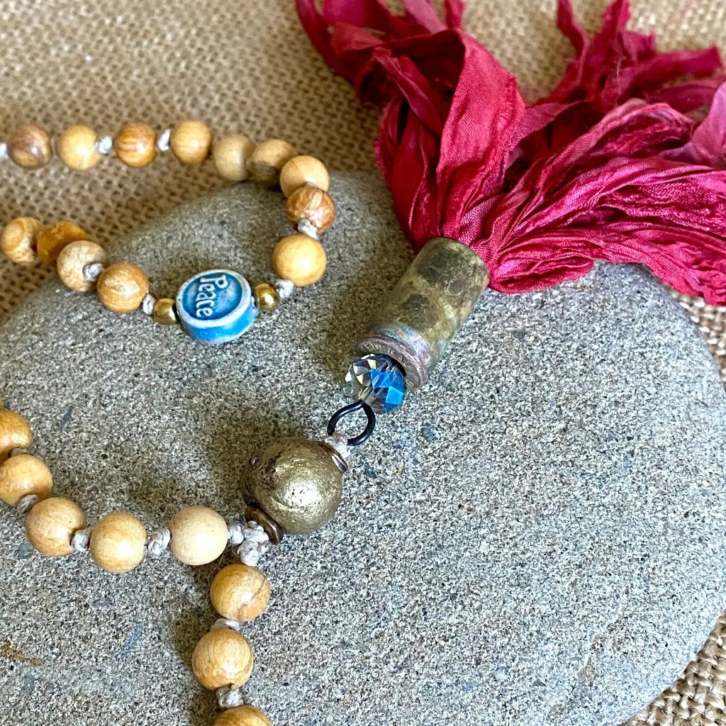 Palo Santo Mala with Nigerian Brass Guru Bead & Red Sari Silk Tassel